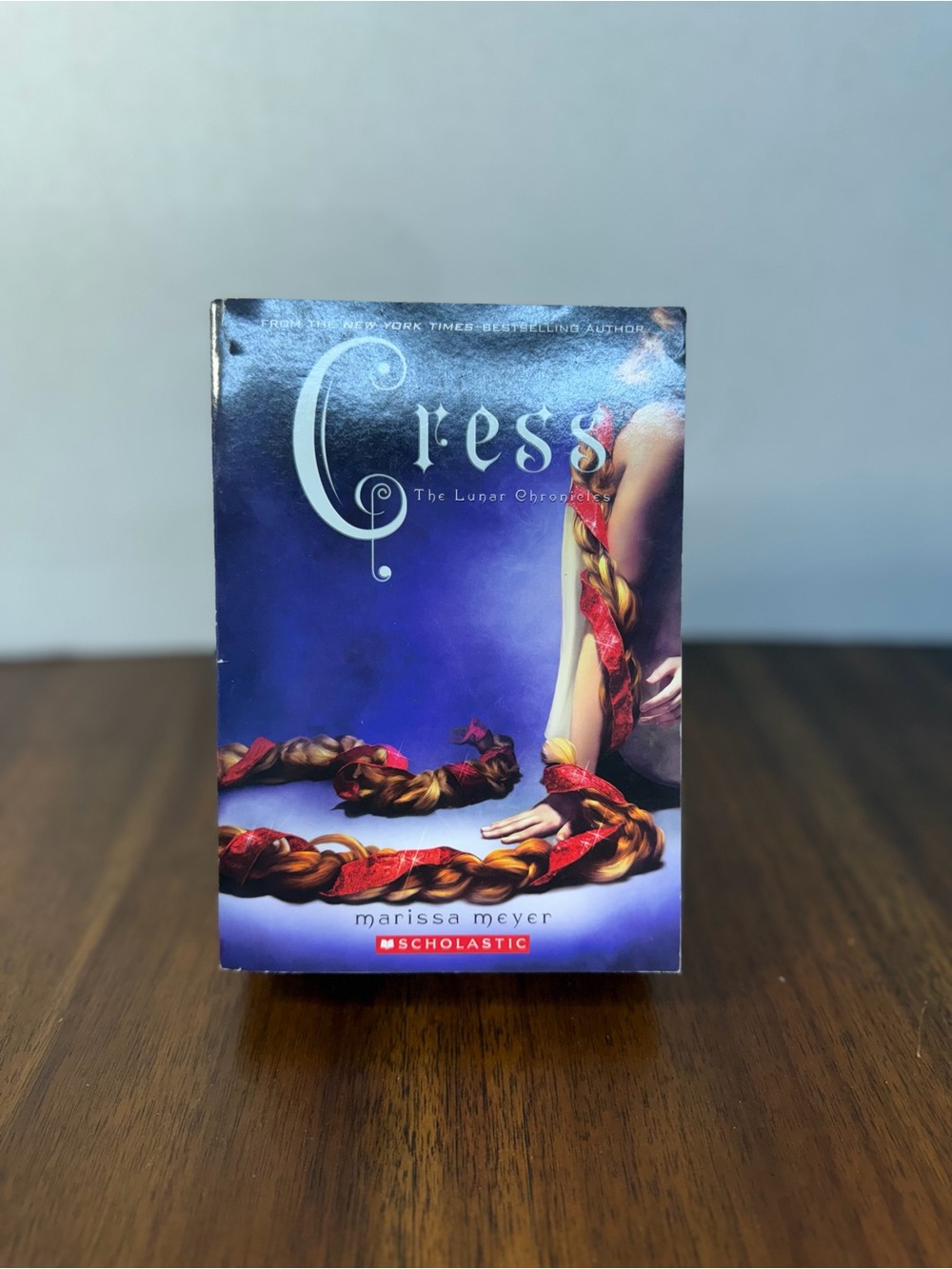 Cress by Marissa Meyer — Purple Cover with Red & Gold Braid Artwork
